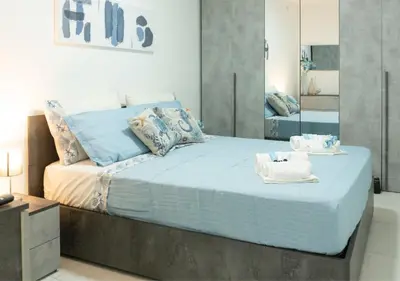 Letto o letti in una camera di VD Residential Apartment Napoli