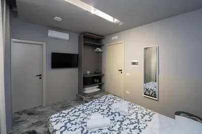 Letto o letti in una camera di Mia Suites Beverello