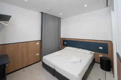 Letto o letti in una camera di Mia Suites Beverello