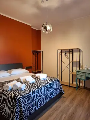 Letto o letti in una camera di Faccia Gialla Napoli Casa Vacanze