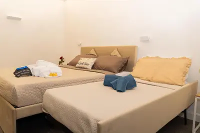 Letto o letti in una camera di Don Lope Suite-Piazza del Plebiscito