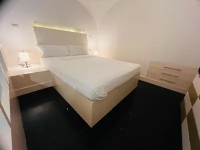 Letto o letti in una camera di Parthenope Home
