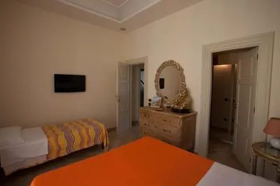 Letto o letti in una camera di B&B Nel Regno di Napoli