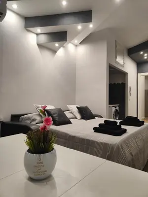 Letto o letti in una camera di Royal Naples