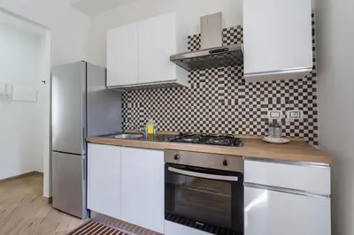 Cucina o angolo cottura di Seaside Apartment by Dimorra