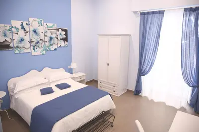 Letto o letti in una camera di La Baia Di Partenope