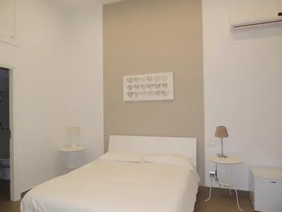 Letto o letti in una camera di La Baia Di Partenope