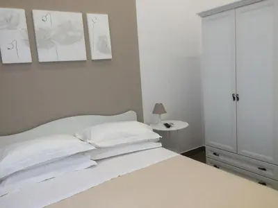 Letto o letti in una camera di La Baia Di Partenope