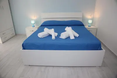 Letto o letti in una camera di B&B Mimela Napoli