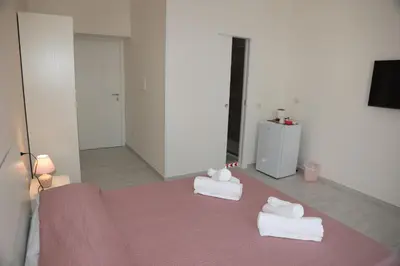 Letto o letti in una camera di B&B Mimela Napoli