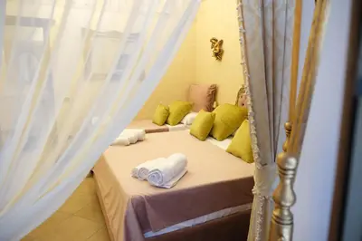 Letto o letti in una camera di La Bella Napoli Home Room di Adriana