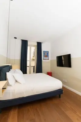 Letto o letti in una camera di Casa Voiello San Bartolomeo