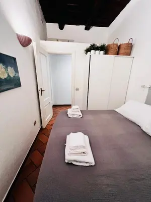 Letto o letti in una camera di La casa di Licia a due passi da Piazza del Plebiscito