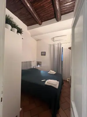 Letto o letti in una camera di La casa di Licia a due passi da Piazza del Plebiscito