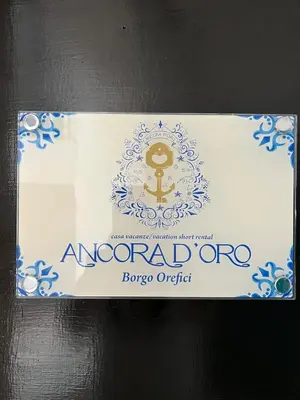 Certificato, attestato, insegna o altro documento esposto da Ancora D'Oro