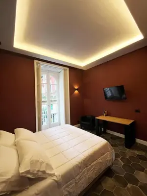 Letto o letti in una camera di Arco del Gigante