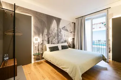 Letto o letti in una camera di NILO RELAIS a san domenico maggiore