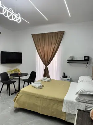 Letto o letti in una camera di Il Ritrovo Spa&Rooms