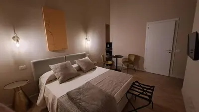 Letto o letti in una camera di Ta-49 bed e breakfast