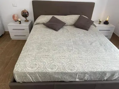 Letto o letti in una camera di CASA SANGIÓ Appartamento nel cuore di Napoli