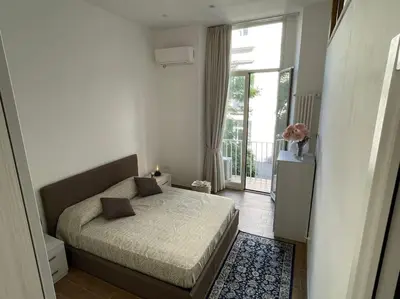 Letto o letti in una camera di CASA SANGIÓ Appartamento nel cuore di Napoli