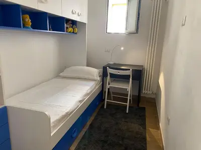Letto o letti in una camera di CASA SANGIÓ Appartamento nel cuore di Napoli