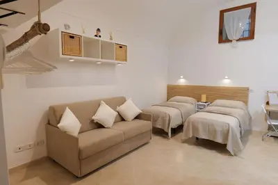 Letto o letti in una camera di Da Zizziella
