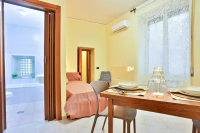 Area soggiorno di GuestHost - Casazzurra - Your place next to Port & Castel Nuovo