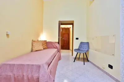 Letto o letti in una camera di GuestHost - Casazzurra - Your place next to Port & Castel Nuovo