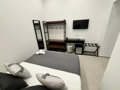 Letto o letti in una camera di Cuore Urbano Montesanto