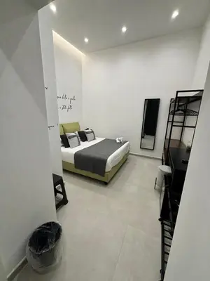 Letto o letti in una camera di Cuore Urbano Montesanto