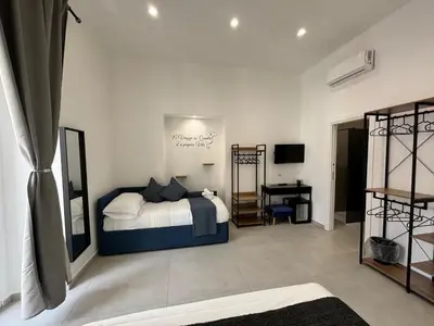 Letto o letti in una camera di Cuore Urbano Montesanto