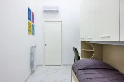 Letto o letti in una camera di Marcellino Comfort House by NapoliApartments