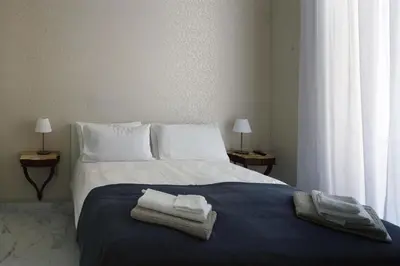 Letto o letti in una camera di Appartamento Bilocale Suororsola 5