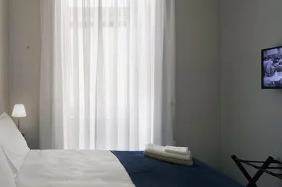 Letto o letti in una camera di Appartamento Bilocale Suororsola 5