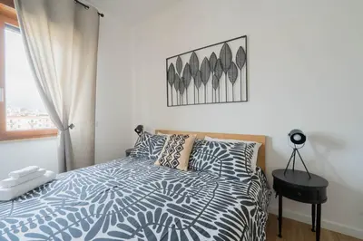 Letto o letti in una camera di LuLi Rooms Napoli
