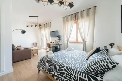 Letto o letti in una camera di LuLi Rooms Napoli