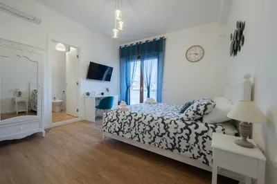 Letto o letti in una camera di LuLi Rooms Napoli