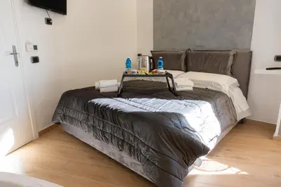Letto o letti in una camera di NA bella vista Rooftop-B&B