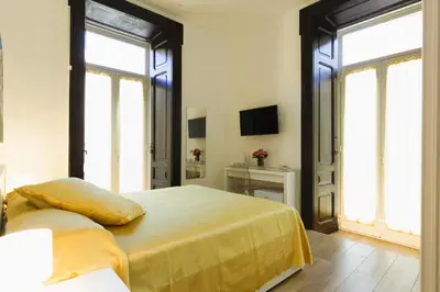 Letto o letti in una camera di B&B Le Tre B