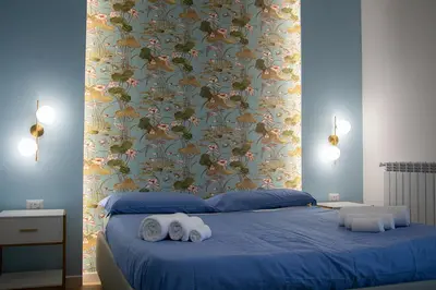Letto o letti in una camera di WANDERLUST SPACCANAPOLI Points Of View
