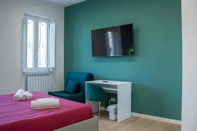 Letto o letti in una camera di WANDERLUST SPACCANAPOLI Points Of View