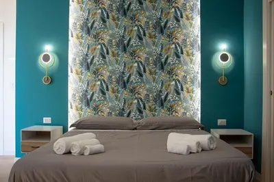 Letto o letti in una camera di WANDERLUST SPACCANAPOLI Points Of View