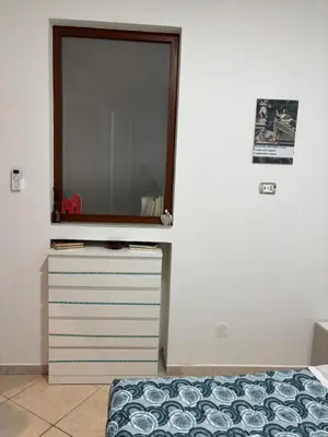 Letto o letti in una camera di Rosso Napoli locazioni brevi