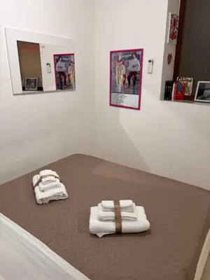 Letto o letti in una camera di Rosso Napoli locazioni brevi
