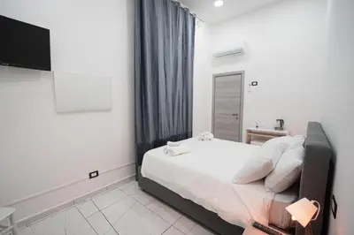 Letto o letti in una camera di La corte dei decumani