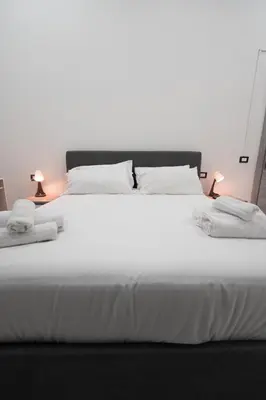 Letto o letti in una camera di La corte dei decumani