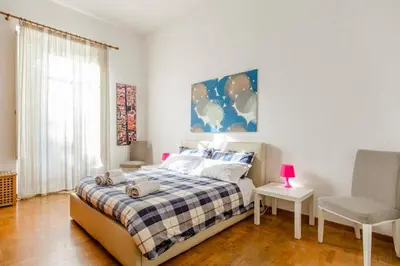 Letto o letti in una camera di Casa Michelangelo