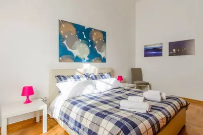 Letto o letti in una camera di Casa Michelangelo