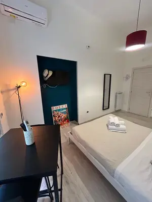 Letto o letti in una camera di NaLusa rooms - in centro a Toledo